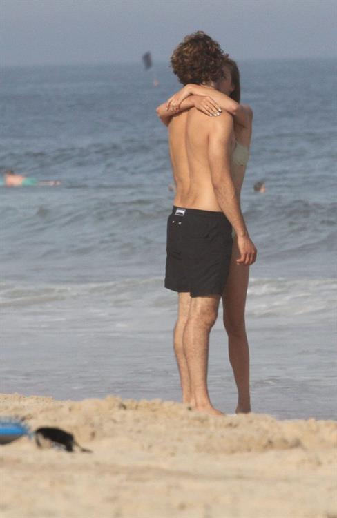 Nina Agdal Bikini Pictures Nina Agdal sexy ass in a thong bikini at the beach with her boyfriend seen by paparazzi.