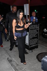 Kourtney Kardashian sexy cleavage in a black top seen by paparazzi.














