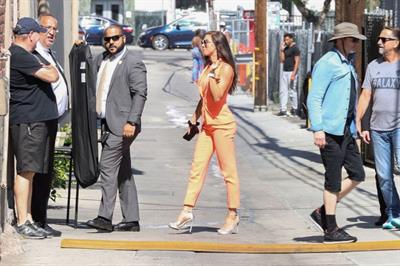 Alex Morgan braless and sexy in a orange jacket seen by paparazzi.








