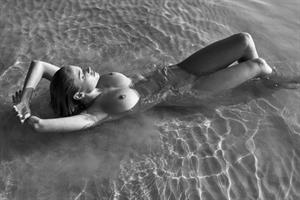 Genevieve Morton Topless Pictures Genevieve Morton nude photo shoot in the water showing her naked boobs.
