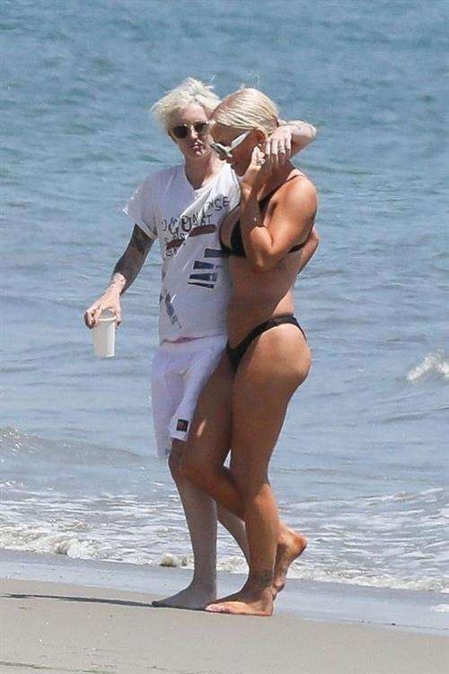 Gigi Gorgeous Bikini Pictures Gigi Gorgeous sexy cleavage in a bikini at the beach with Nats Getty seen by paparazzi.