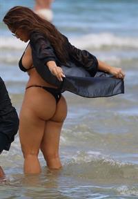 Daphne Joy sexy ass and boobs in a thong bikini at the beach seen by paparazzi showing nice cleavage and booty.
