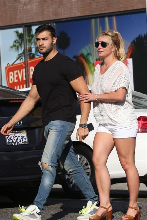 Britney Spears Pictures Britney Spears braless boobs in a see through blouse showing her nipples seen by paparazzi.