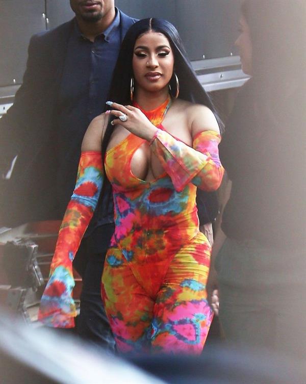 Cardi B boobs and booty on display on and off stage showing nice cleavage and her sexy ass in a tight dress.























