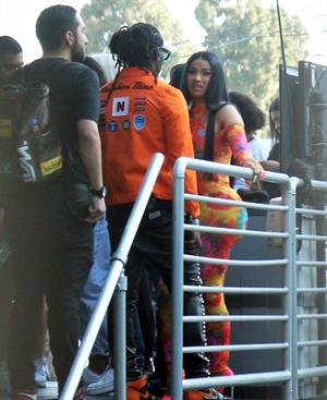 Cardi B boobs and booty on display on and off stage showing nice cleavage and her sexy ass in a tight dress.























