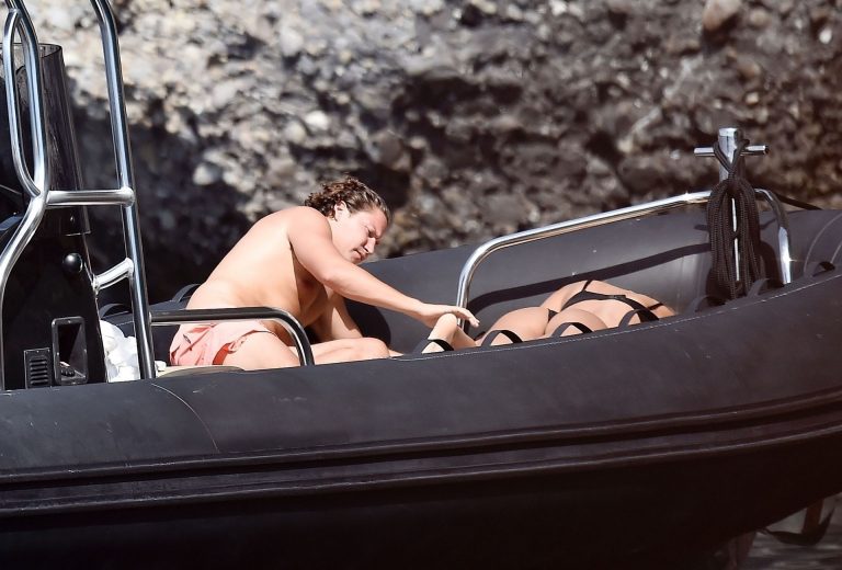 Mădălina Diana Ghenea Bikini Pictures Madalina Diana Ghenea sexy ass and cleavage in a thong bikini seen by paparazzi.