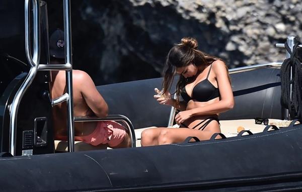 Madalina Diana Ghenea sexy ass and cleavage in a thong bikini seen by paparazzi.


