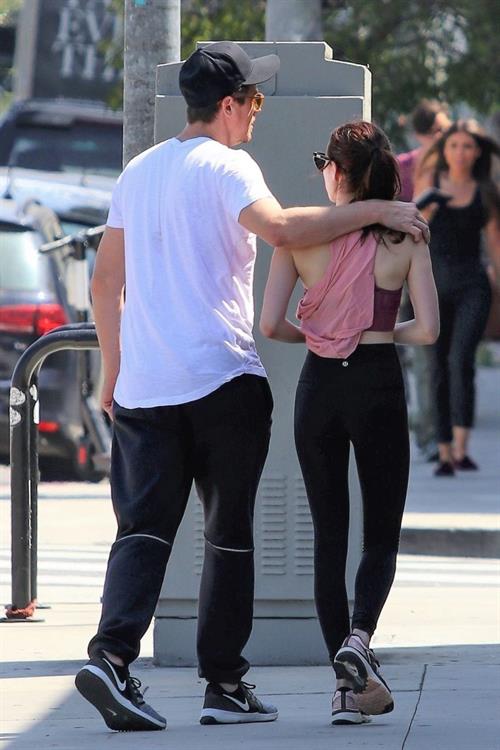 Emma Roberts Pictures Emma Roberts sexy little ass and thigh gap in tight pants seen by paparazzi with Garrett Hedlund.