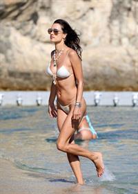 Alessandra Ambrosio Bikini Pictures Alessandra Ambrosio ass and cleavage in a sexy thong bikini at the beach seen by paparazzi.