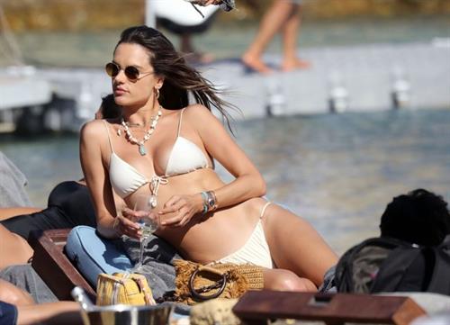 Alessandra Ambrosio Bikini Pictures Alessandra Ambrosio ass and cleavage in a sexy thong bikini at the beach seen by paparazzi.