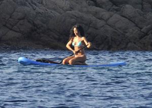 Rihanna paddle boarding