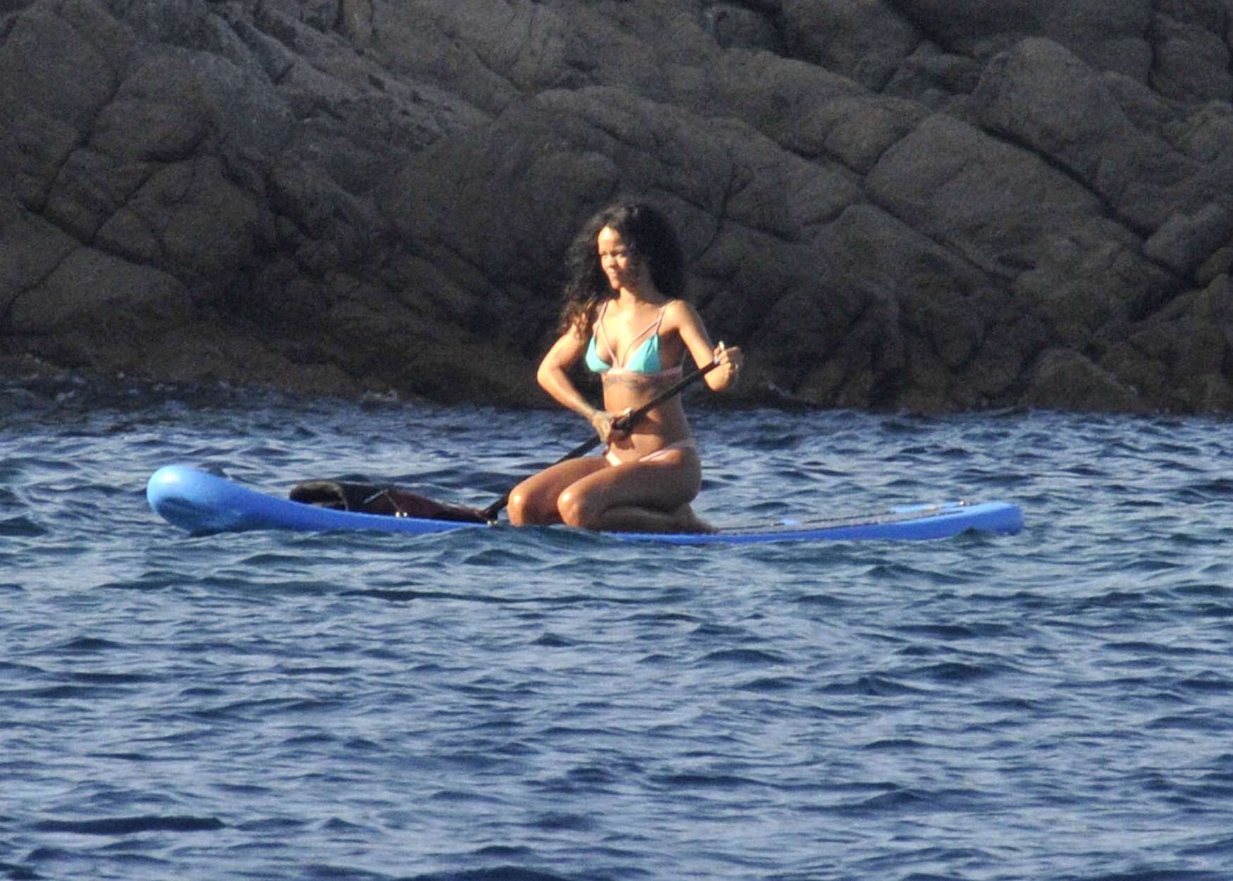 Rihanna paddle boarding