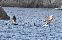 Rihanna paddle boarding