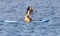 Rihanna paddle boarding