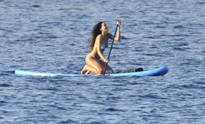 Rihanna paddle boarding