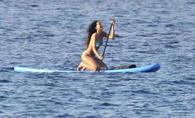 Rihanna paddle boarding