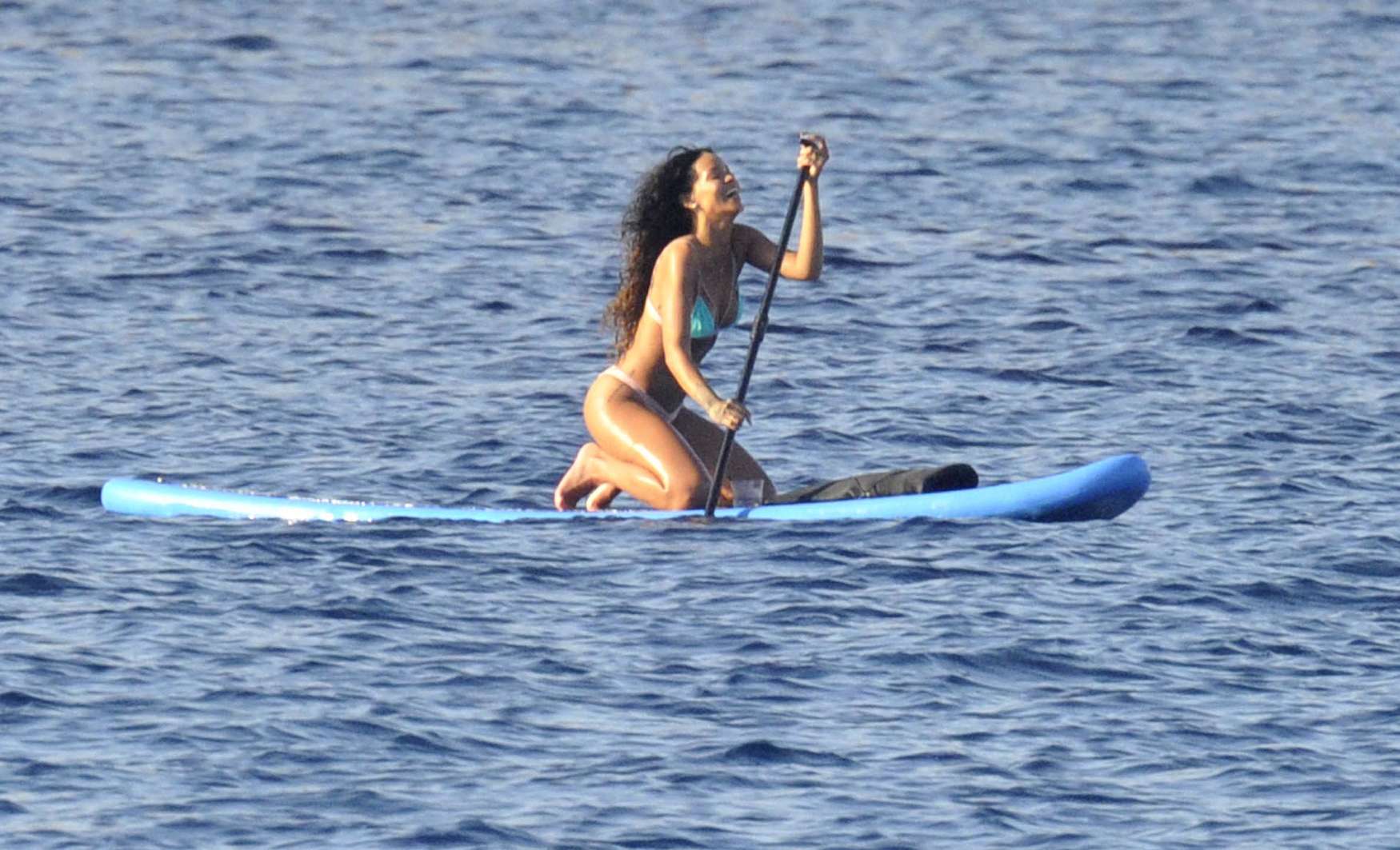 Rihanna paddle boarding