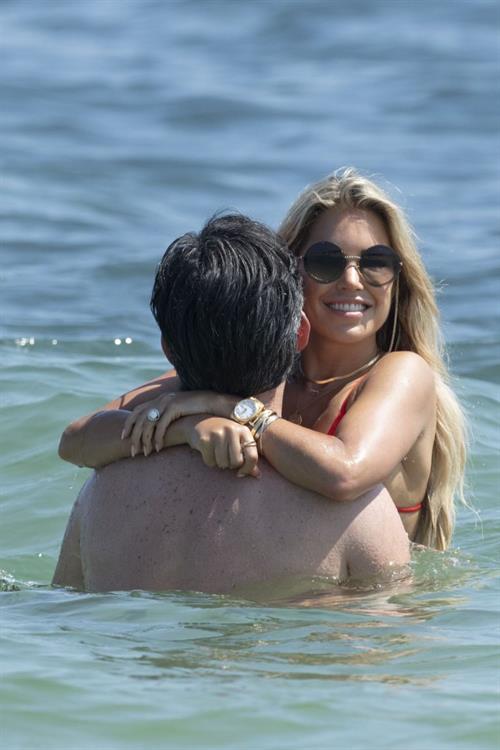 Sylvie van der Vaart Bikini Pictures Sylvie Meis sexy ass in a bikini at the beach with her new boyfriend at the beach seen by paparazzi.
