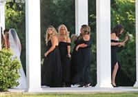 Selena Gomez sexy in a black dress for her cousins wedding showing nice cleavage seen by paparazzi.























