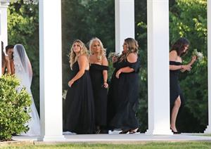 Selena Gomez sexy in a black dress for her cousins wedding showing nice cleavage seen by paparazzi.























