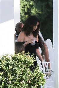 Selena Gomez sexy in a black dress for her cousins wedding showing nice cleavage seen by paparazzi.























