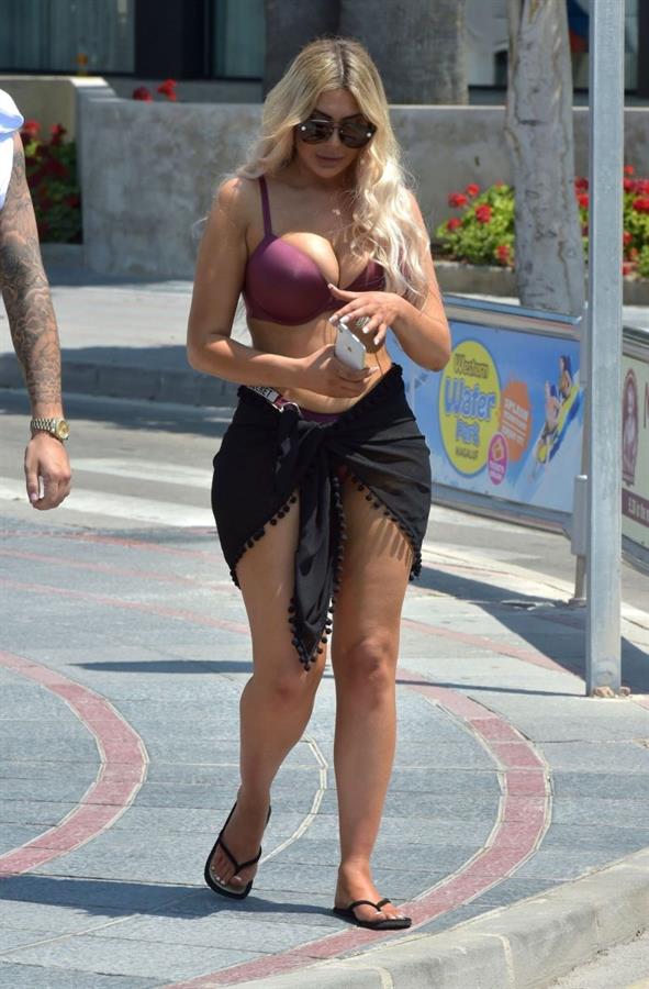 Chloe Ferry big boobs showing nice cleavage seen by paparazzi in a sexy bikini.








