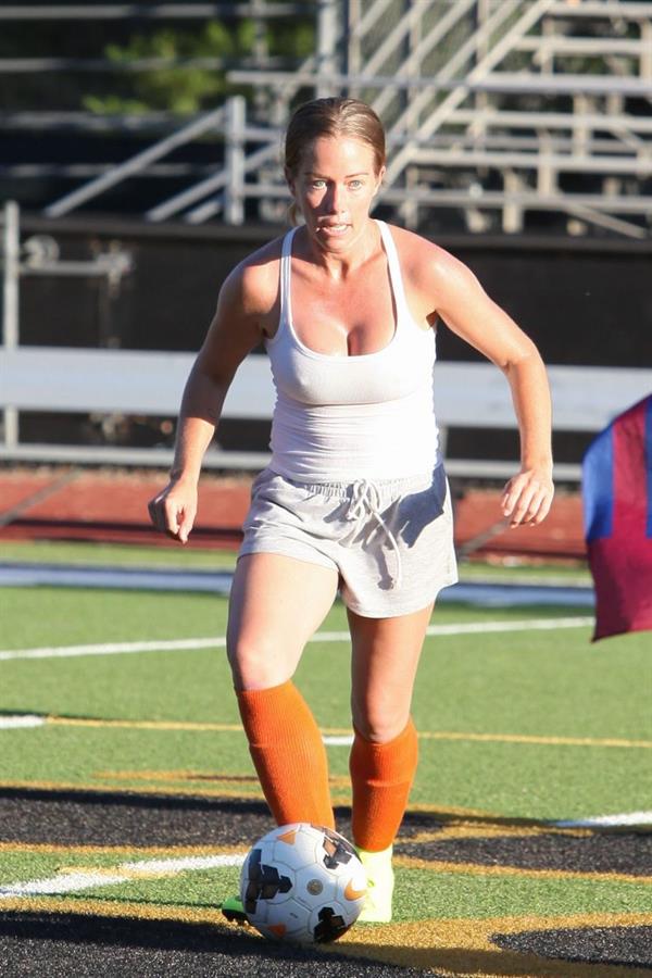 Kendra Wilkinson braless boobs showing her tits pokies seen by paparazzi playing soccer seen by paparazzi.












