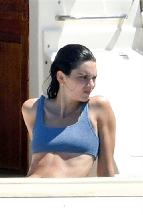 Kendall Jenner Bikini Pictures Kendall Jenner in a sexy bikini swimsuit on a yacht with Kourtney Kardashian seen by paparazzi.