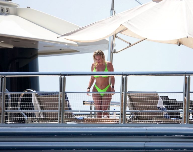 Stassie Karanikolaou Bikini Pictures Stassie Karanikolaou sexy ass in a green thong bikini showing nice cleavage with her big boobs seen by paparazzi.