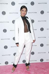 Priyanka Chopra braless boobs in a see through top showing some nice cleavage at Beautycon.

