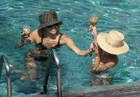 Miley Cyrus and Kaitlynn Carter making out kissing by the pool seen by paparazzi showing her lesbian side after leaving Liam Hemsworth.




