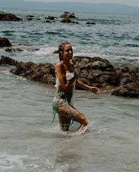 Kristin Cavallari topless seen by paparazzi at the beach covering her nude boobs with her arms.







