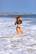 Ana Braga boobs in a fully see through top at the beach showing her tits seen by paparazzi.


