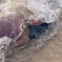 Salma Hayek big boobs showing nice cleavage wet in a swimsuit laying on the beach.

























