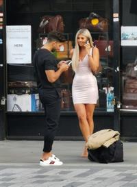 Belle Hassan wardrobe malfunction as the ass of her dress rips she had to call someone to sew it seen by paparazzi.




