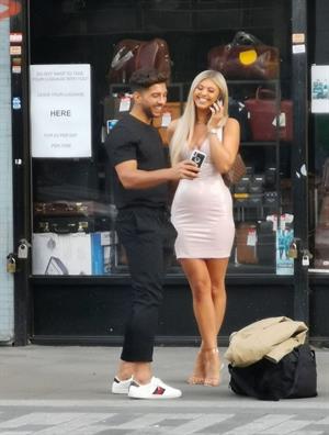 Belle Hassan wardrobe malfunction as the ass of her dress rips she had to call someone to sew it seen by paparazzi.




