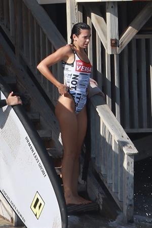 Dua Lipa sexy ass and cleavage in a swimsuit at the beach seen with her boyfriend by paparazzi.













