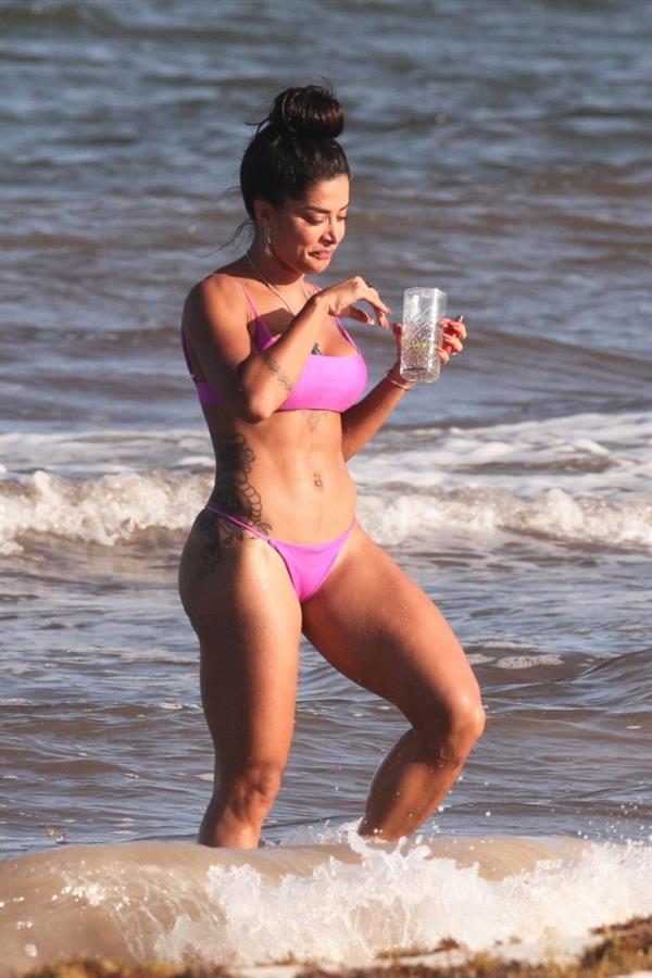 Aline Riscado seen at the beach by paparazzi in a sexy ass thong bikini showing nice cleavage.


