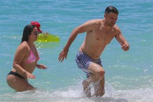 Stassi Schroeder and Katie Maloney-Schwartz sexy at the beach seen by paparazzi in a bikini and a swimsuit showing nice cleavage.