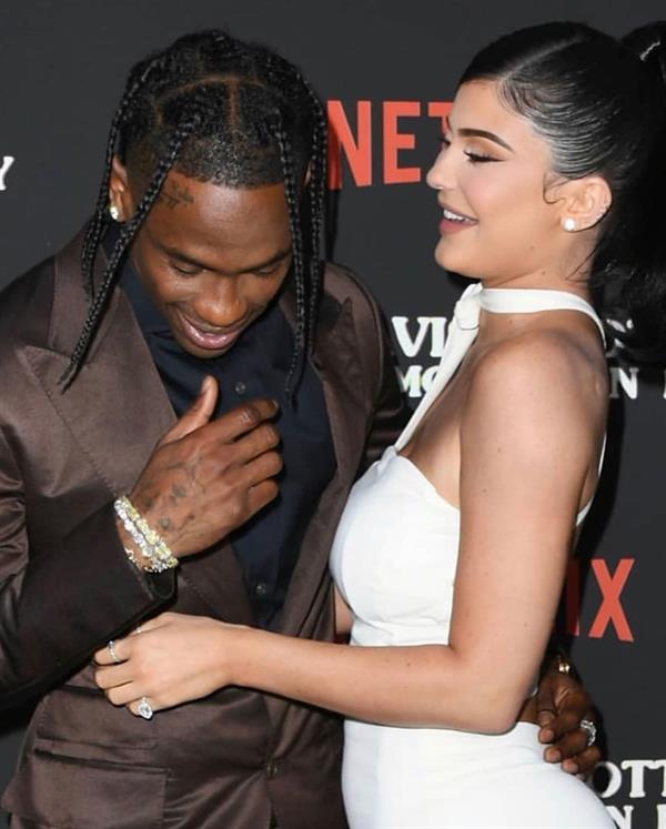 Kylie Jenner sexy ass in a tight white dress with Travis Scott at the premiere of  Look Mom I Can Fly .





































