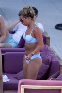 Dani Dyer sexy ass in a bikini seen by the pool with friends by paparazzi.















































