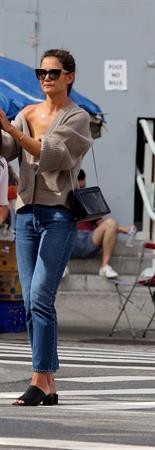 Katie Holmes sexy cleavage seen by paparazzi in a revealing outfit.

