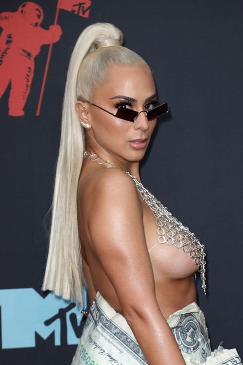 Veronica Vega Pictures Veronica Vega showing off her braless boobs on the red carpet at the MTV VMA's in a see through top.