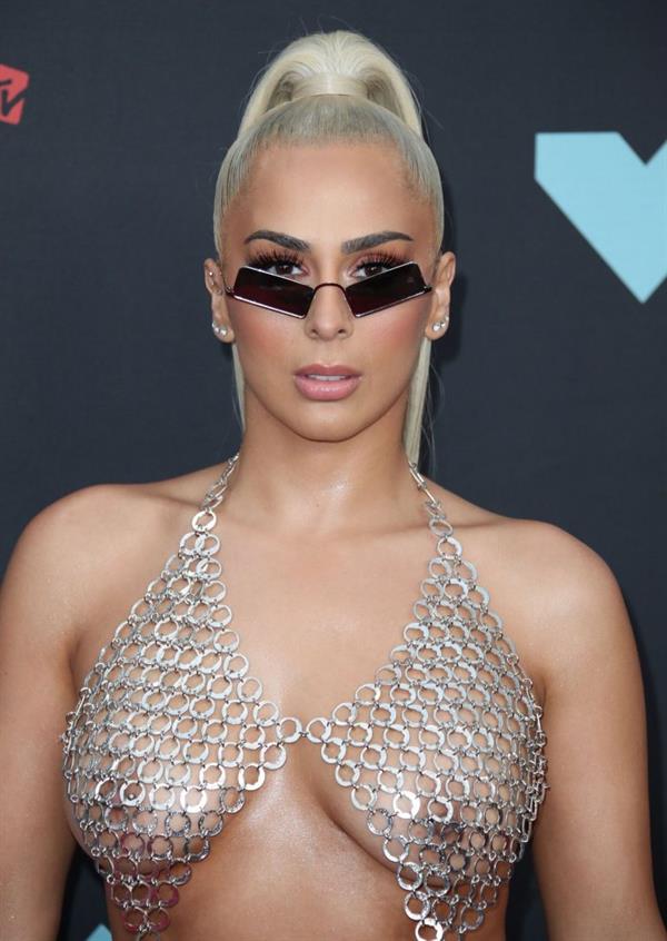 Veronica Vega showing off her braless boobs on the red carpet at the MTV VMA's in a see through top.














