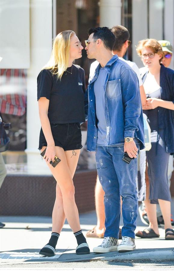 Sophie Turner braless boobs kissing Joe Jonas seen by paparazzi.
















