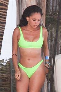 Vanessa Morgan in a tight green bikini showing nice cleavage and her sexy ass seen by paparazzi.




















