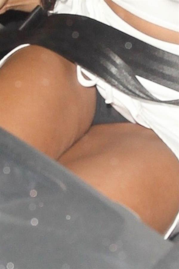 Tinashe upskirt wardrobe malfunction flashing her panties in the car seen by paparazzi.



