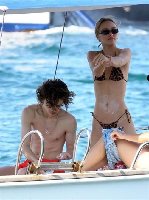 Lily-Rose Depp Bikini Pictures Lily-Rose Depp sexy ass in a little thong bikini making out with Timothee Chalamet on a boat seen by paparazzi.