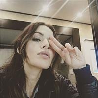 Sarah Shahi taking a selfie