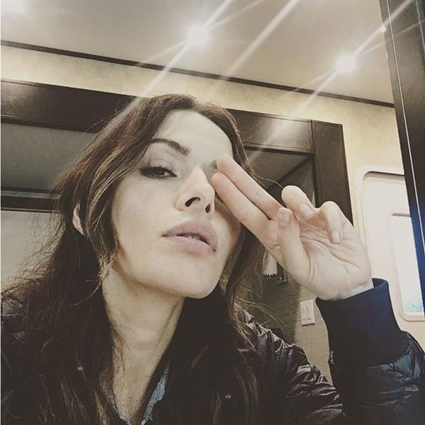 Sarah Shahi taking a selfie